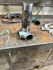 Stainless pipe sections fabricated on a shop workbench