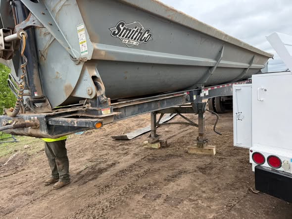On-site trailer repair with the service truck alongside